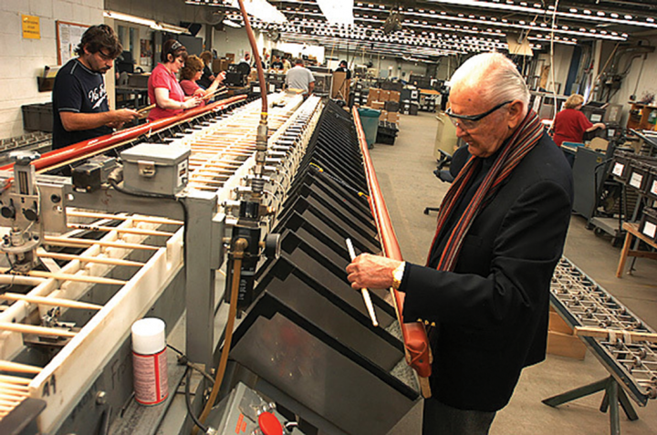 Vic inspecting drumsticks at the factory in 2003