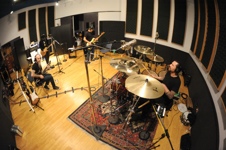 Tempesta in the studio with, from left, Scott Ian, Jim Wilson, and Joey Vera